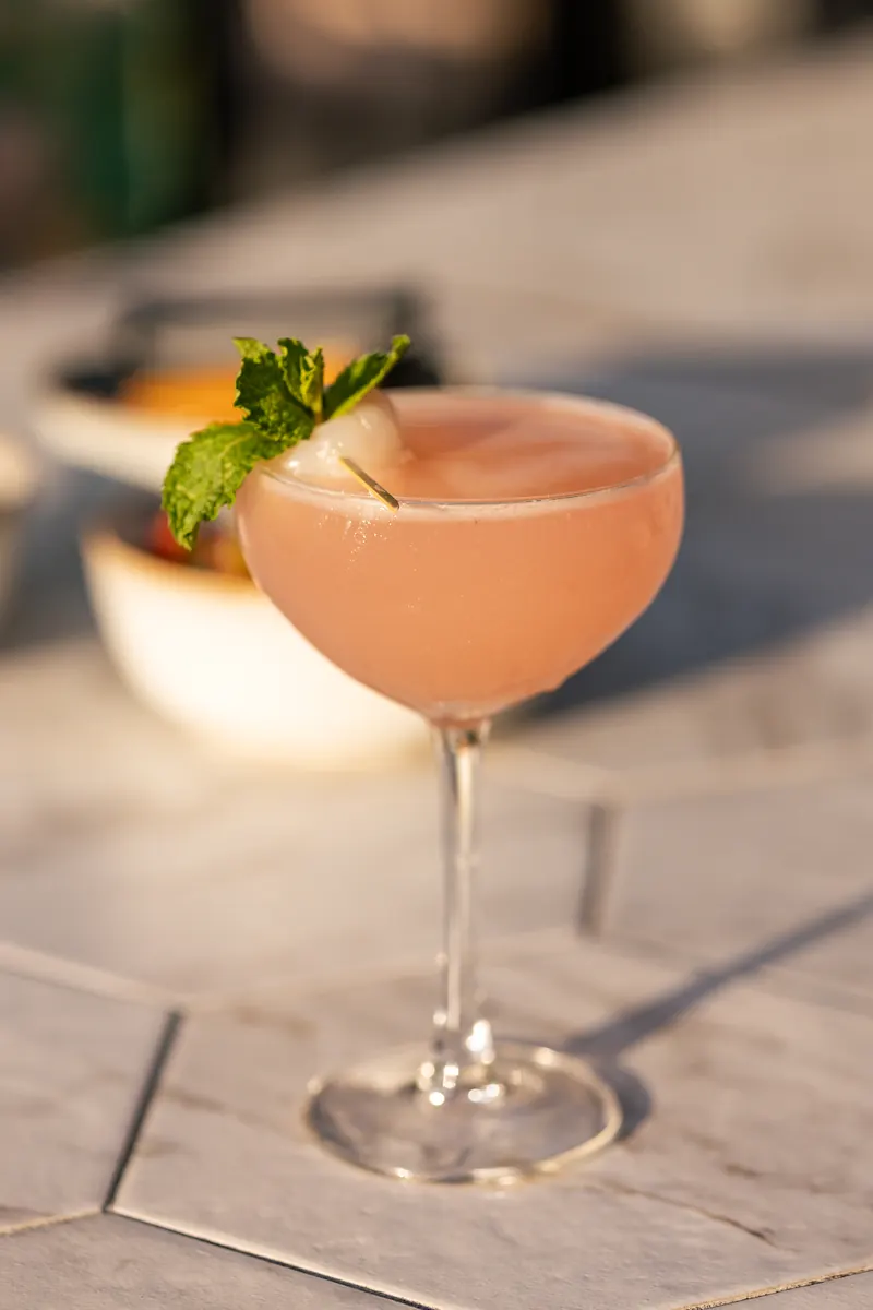 Pink cocktail with mint on the Terrat terrace