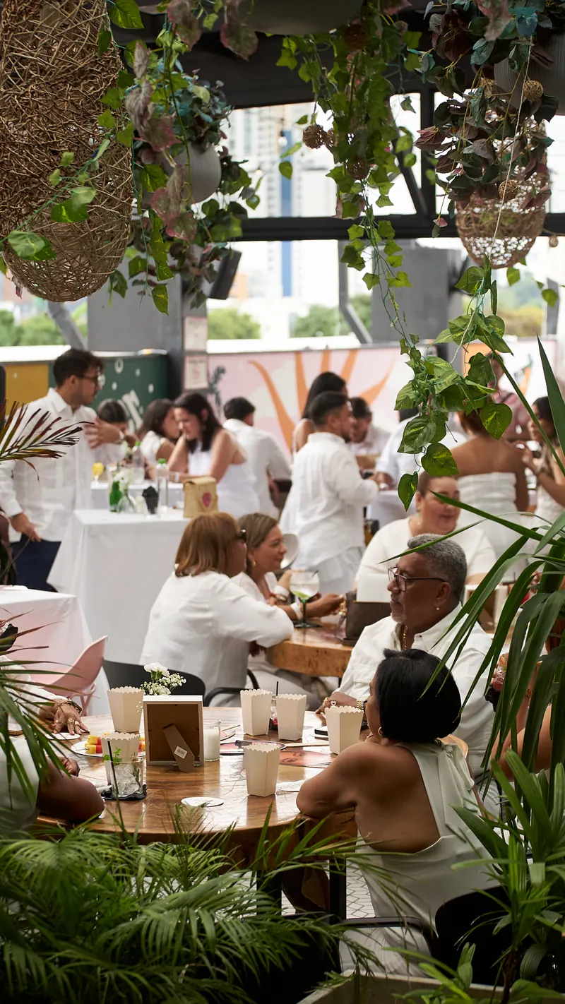 Private event with white-dressed tables on the Terrat terrace